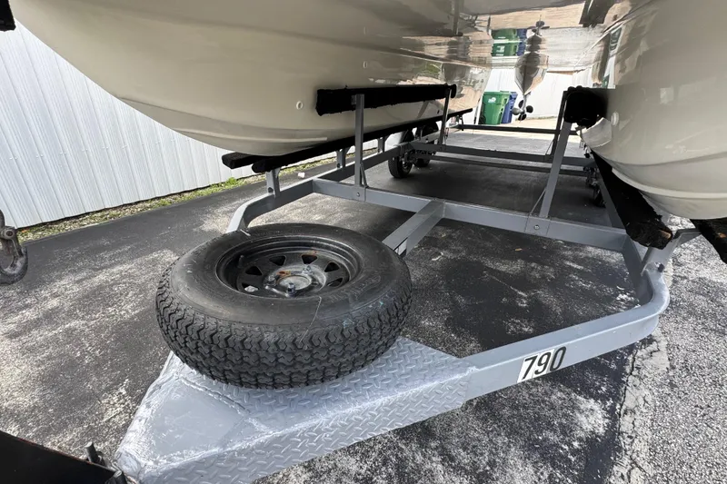 Slide: The Image of Trailer for 2018 Beachcat 20 boat with spare tire on asphalt. - 52