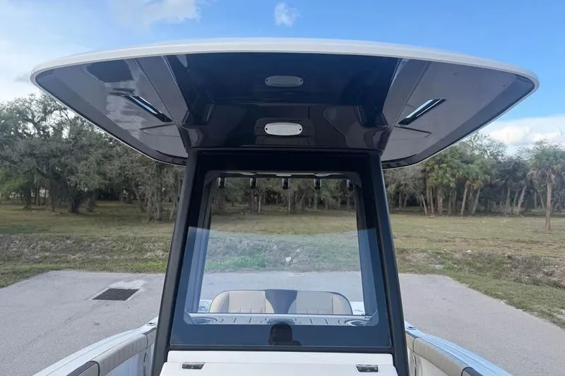 Slide: The Image of 2023 Yamaha Boats 255 FSH Sport E, featuring sleek design and spacious deck. - 17