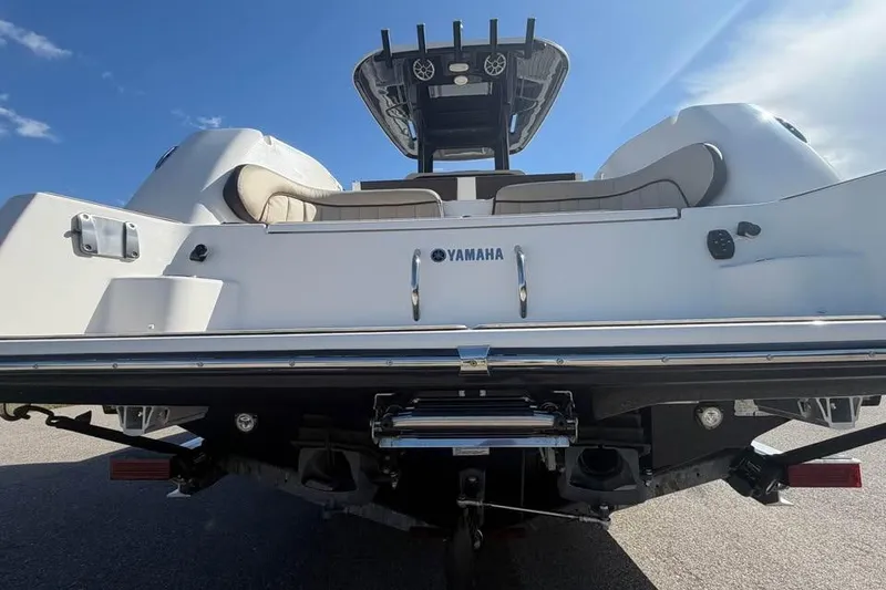 Slide: The Image of 2023 Yamaha Boats 255 FSH Sport E, rear view, showcasing sleek design and features. - 9