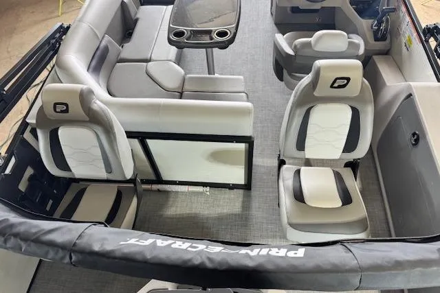 Slide: The Image of 2026 Princecraft Sportfisher 21-2RS interior with plush seating and modern design. - 12