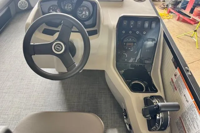Slide: The Image of Steering console of 2026 Princecraft Sportfisher 21-2RS boat with control panel and gauges. - 13