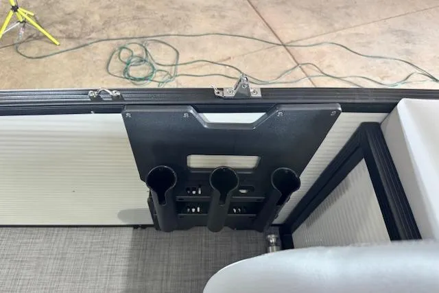 Slide: The Image of Interior view of a 2026 Princecraft Sportfisher 21-2RS boat with rod holders. - 16