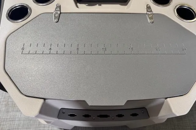 Slide: The Image of 2026 Princecraft Sportfisher 21-2RS boat console with integrated measuring ruler and cup holders. - 24