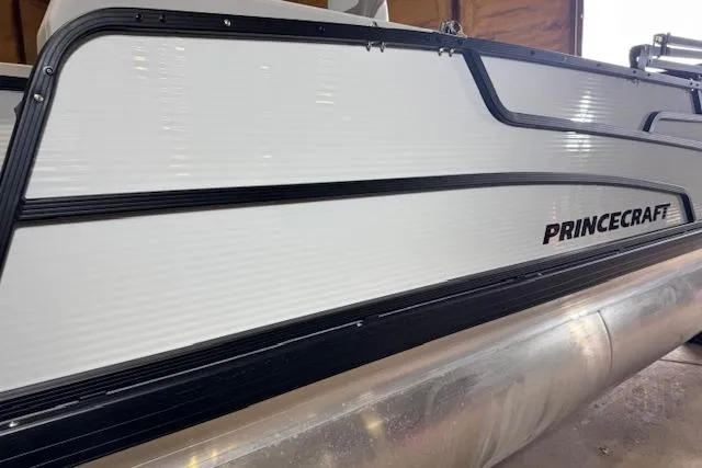 Slide: The Image of 2026 Princecraft Sportfisher 21-2RS pontoon boat, sleek white exterior with black trim. - 6