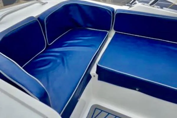 Slide: The Image of Blue cushioned seating on a 1988 Mediterranean 38 Convertible boat. - 16