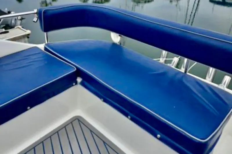 Slide: The Image of Blue cushioned seating on 1988 Mediterranean 38 Convertible yacht deck. - 17