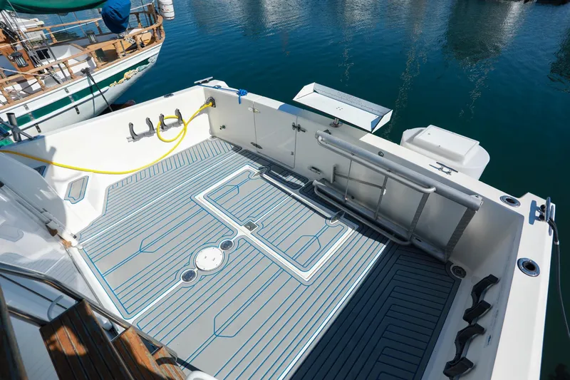 Slide: The Image of Spacious deck of 1988 Mediterranean 38 Convertible yacht, featuring modern fittings and ocean backdrop. - 25