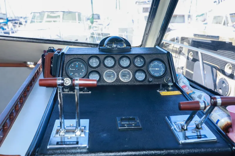 Slide: The Image of Cockpit of a 1988 Mediterranean 38 Convertible boat with gauges and controls. - 34