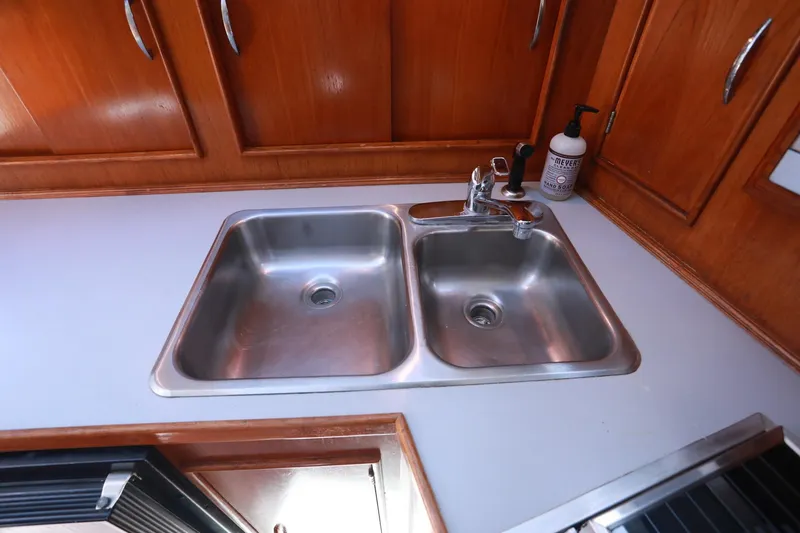 Slide: The Image of Stainless steel double sink in 1988 Mediterranean 38 Convertible yacht kitchen. - 39