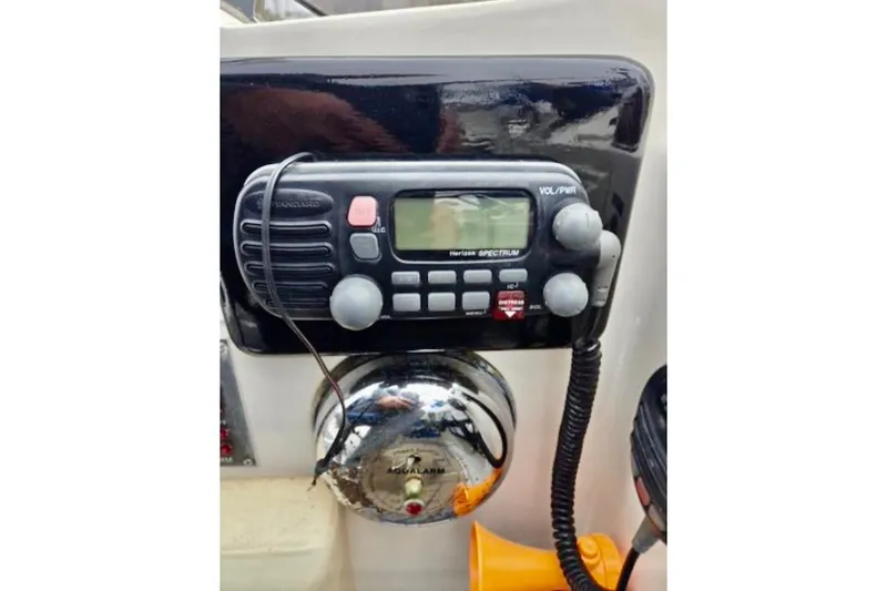 Slide: The Image of VHF marine radio on 1988 Mediterranean 38 Convertible boat dashboard. - 55