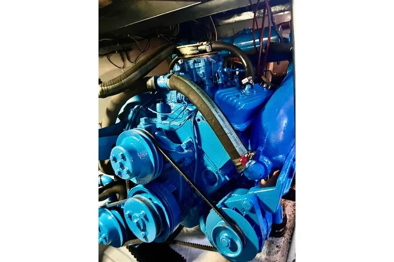 Slide: The Image of Blue engine of a 1988 Mediterranean 38 Convertible boat, showcasing detailed components. - 57