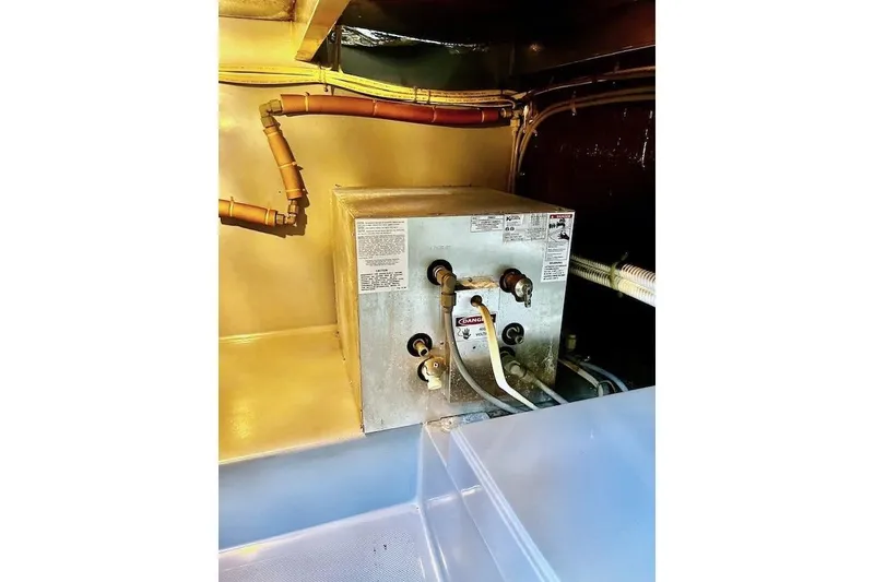 Slide: The Image of Engine room of 1988 Mediterranean 38 Convertible boat with mechanical equipment. - 59