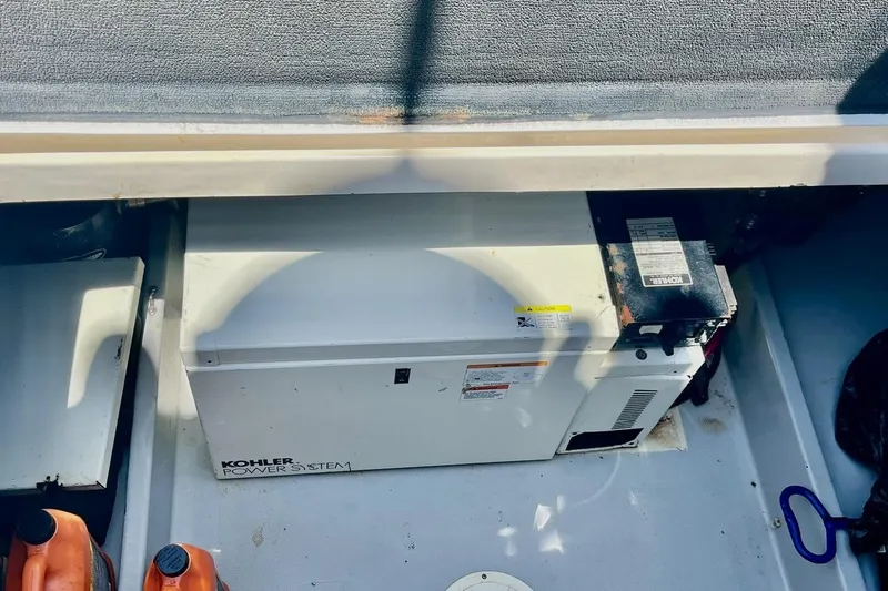Slide: The Image of Kohler power system in 1988 Mediterranean 38 Convertible boat engine room. - 63