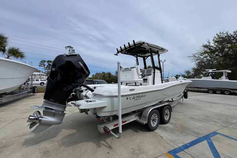 Slide: The Image of 2026 Caymas 26 HB boat on trailer with powerful outboard motor. - 11