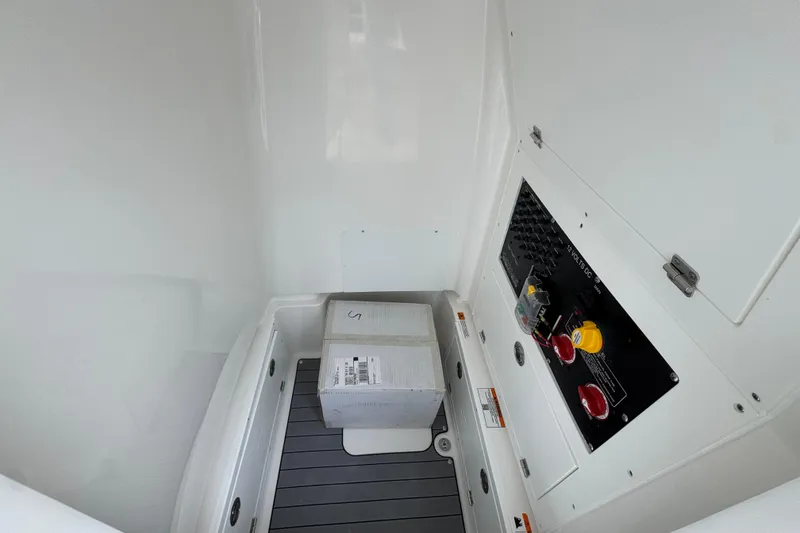 Slide: The Image of Interior view of 2026 Caymas 26 HB boat compartment with control panel and package. - 27
