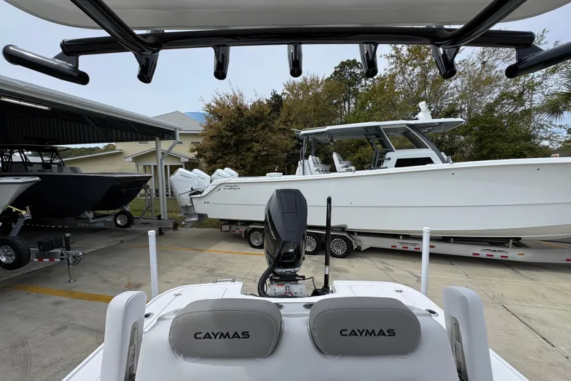 Slide: The Image of 2026 Caymas 26 HB boat in marina, featuring sleek design and modern equipment. - 30