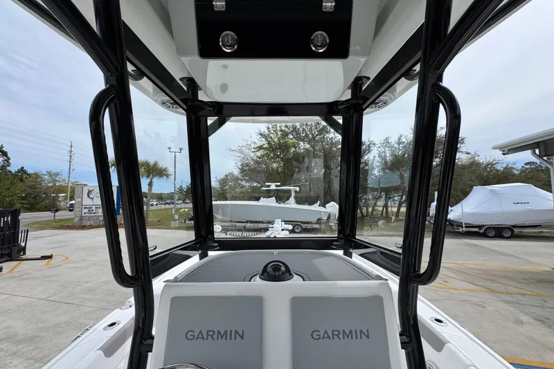 Slide: The Image of 2026 Caymas 26 HB boat interior with Garmin displays, showcasing modern navigation technology. - 34