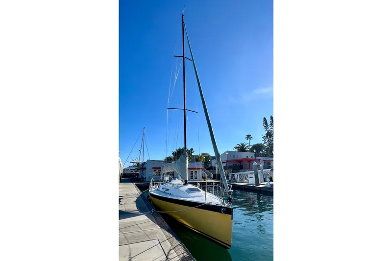 Slide: The Image of 2003 J Boats J/109 sailboat docked in sunny marina setting. - 13