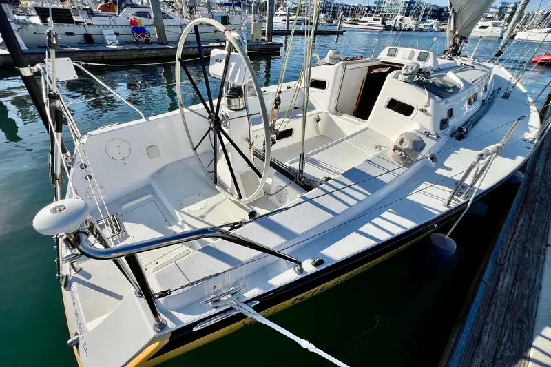 Slide: The Image of 2003 J Boats J/109 sailboat docked at marina, featuring spacious cockpit and sleek design. - 17