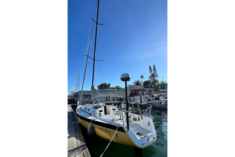 Slide: The Image of 2003 J Boats J/109 sailboat docked in marina under clear blue sky. - 20