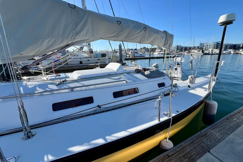 Slide: The Image of 2003 J Boats J/109 sailboat docked in a marina under clear blue skies. - 21