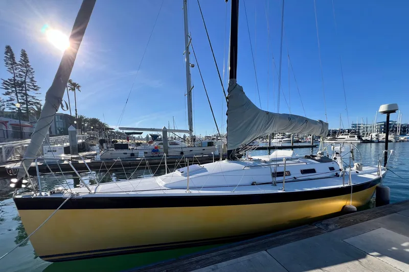 Slide: The Image of 2003 J Boats J/109 sailboat docked in a sunny marina setting. - 22