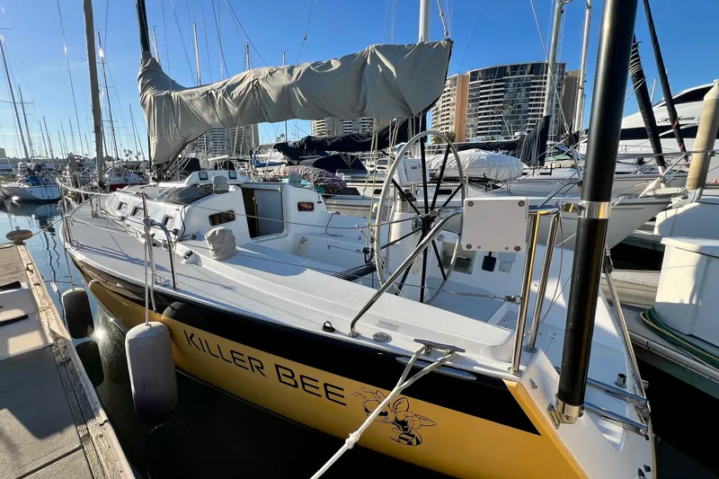 Slide: The Image of 2003 J Boats J/109 sailboat "Killer Bee" docked in marina, sunny day. - 27