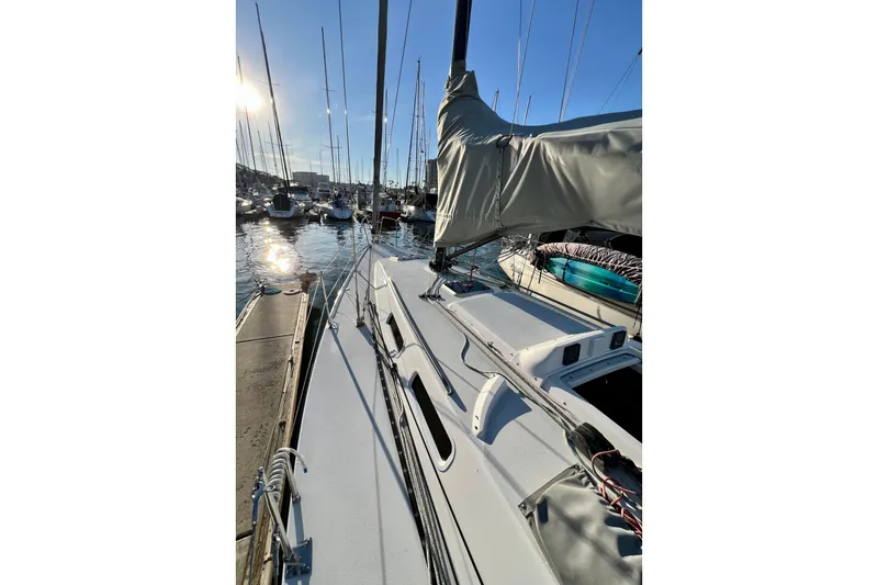 Slide: The Image of 2003 J Boats J/109 sailboat docked in a sunny marina. - 31