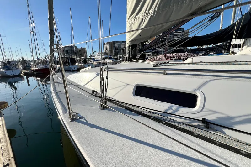 Slide: The Image of 2003 J Boats J/109 sailboat docked in marina, sunny day, clear reflections on water. - 32