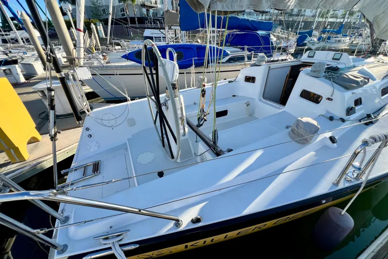 Slide: The Image of 2003 J Boats J/109 sailboat docked, featuring a spacious cockpit and sleek design. - 41