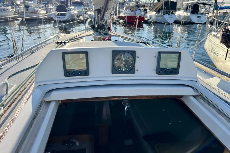 Slide: The Image of Cockpit view of a 2003 J Boats J/109 sailboat with navigation instruments. - 43