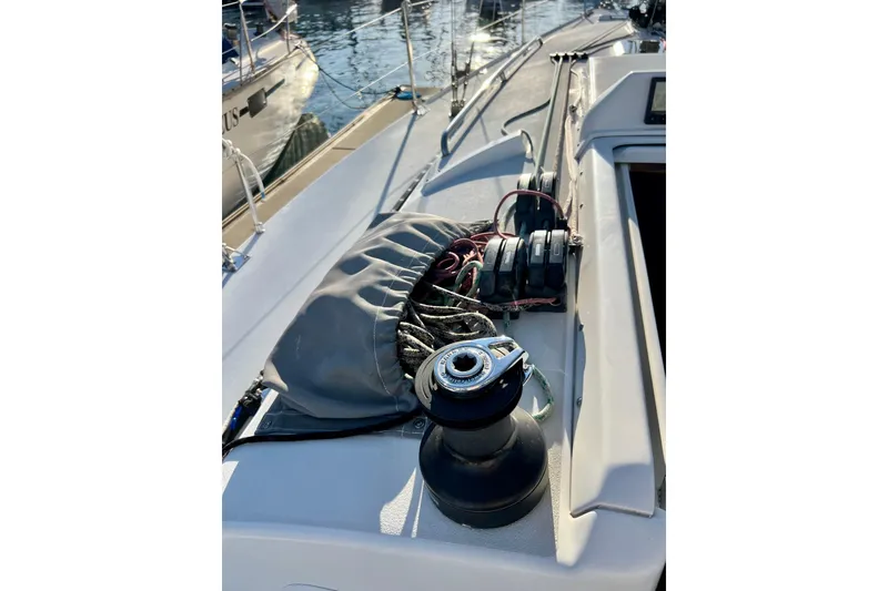 Slide: The Image of Deck view of a 2003 J Boats J/109 sailboat, featuring winch and rigging. - 44