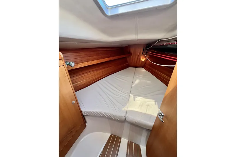 Slide: The Image of Cozy cabin interior of 2003 J Boats J/109 sailboat with wooden finish. - 64