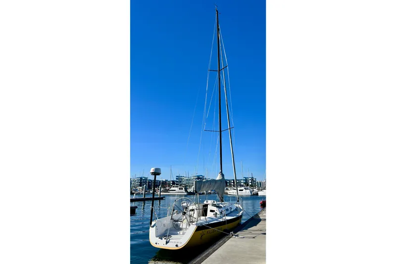 Slide: The Image of 2003 J Boats J/109 sailboat docked at marina under clear blue sky. - 7