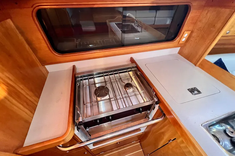 Slide: The Image of Galley kitchen in 2003 J Boats J/109 yacht with stove and sink. - 75