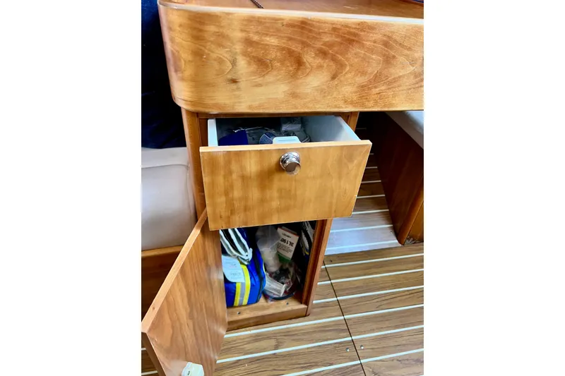 Slide: The Image of Wooden interior storage on 2003 J Boats J/109, featuring open drawer and cabinet. - 80
