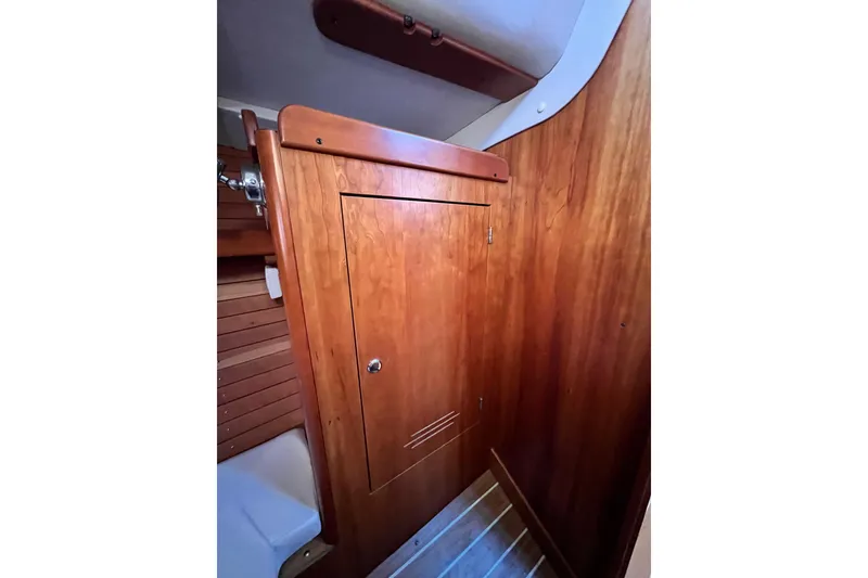 Slide: The Image of Interior of 2003 J Boats J/109 sailboat featuring wooden cabinetry and flooring. - 93