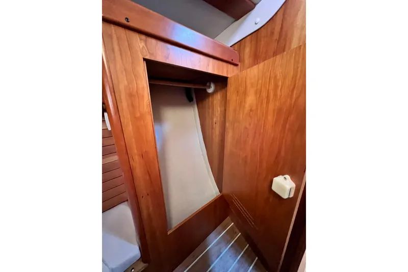 Slide: The Image of Wooden interior of 2003 J Boats J/109 sailboat, featuring a closet space. - 94