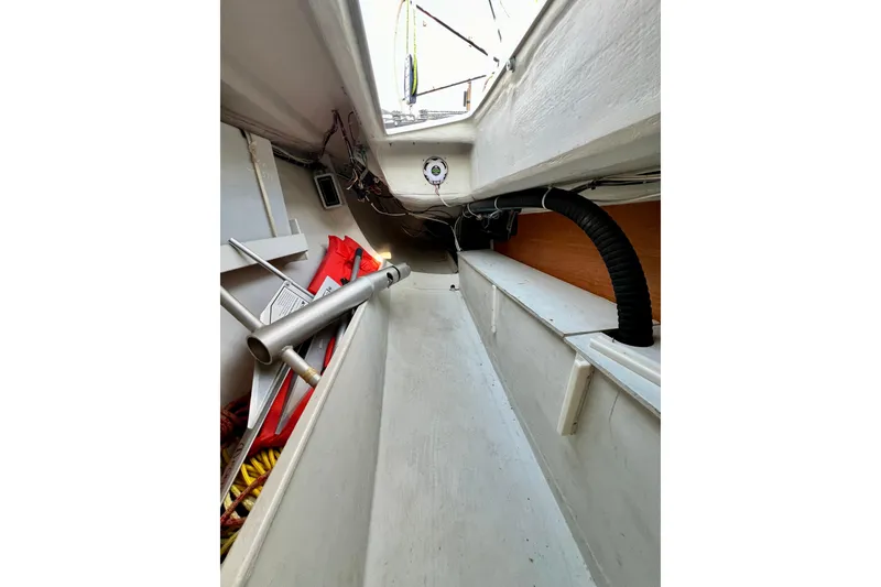 Slide: The Image of Interior view of a 2003 J Boats J/109 sailboat, showing storage and equipment. - 95