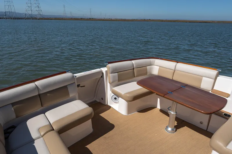 Slide: The Image of Interior of 2012 Tiara Yachts 3100 Coronet with seating and table. - 10