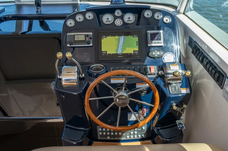 Slide: The Image of 2012 Tiara Yachts 3100 Coronet helm with navigation system. - 17