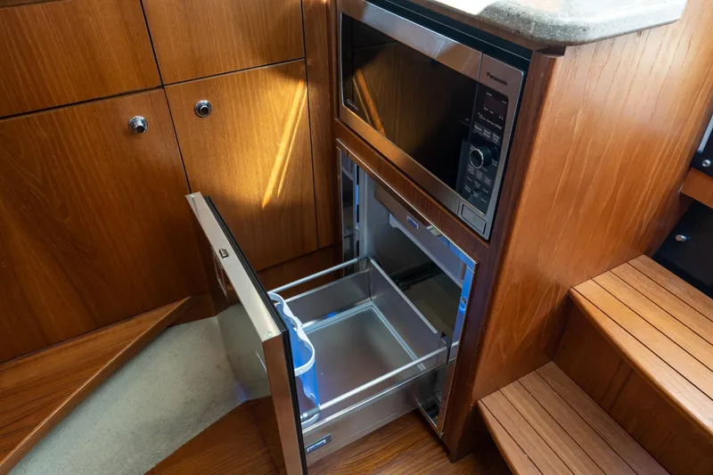 Slide: The Image of Interior of 2012 Tiara Yachts 3100 Coronet with microwave and drawer. - 22