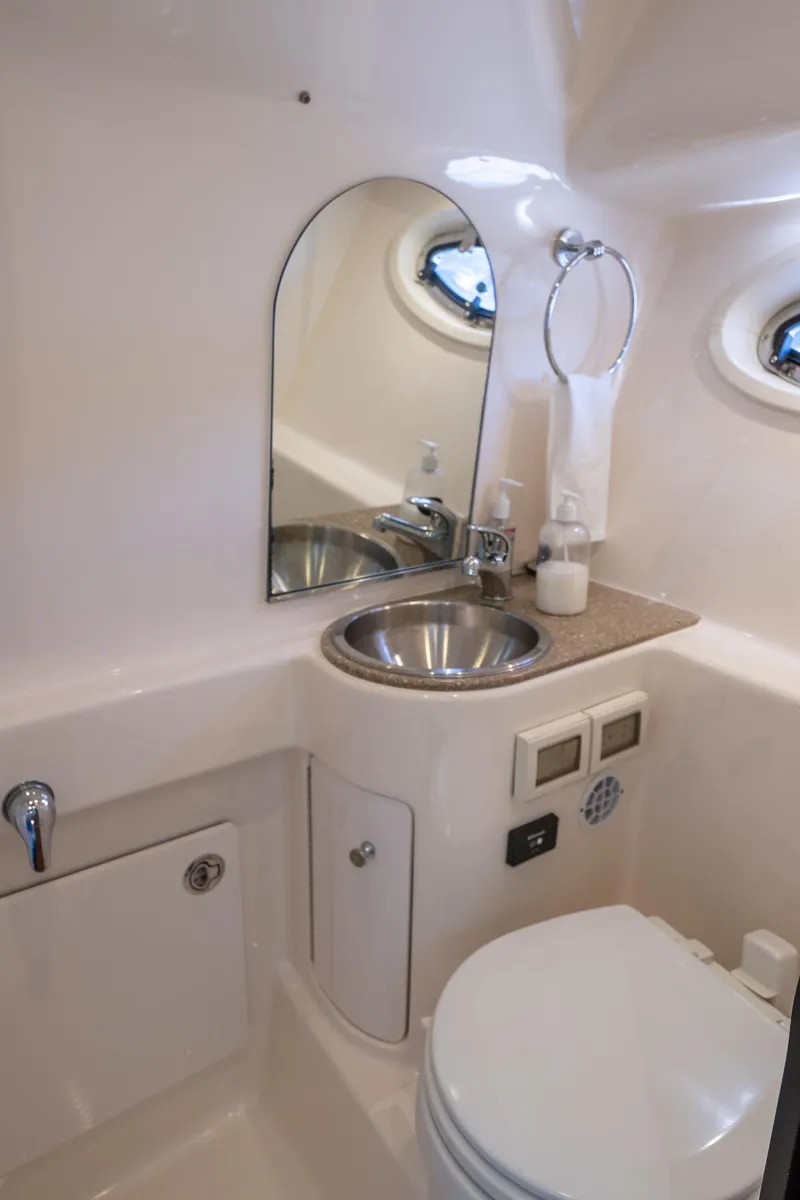 Slide: The Image of 2012 Tiara Yachts 3100 Coronet bathroom with sink and toilet. - 23