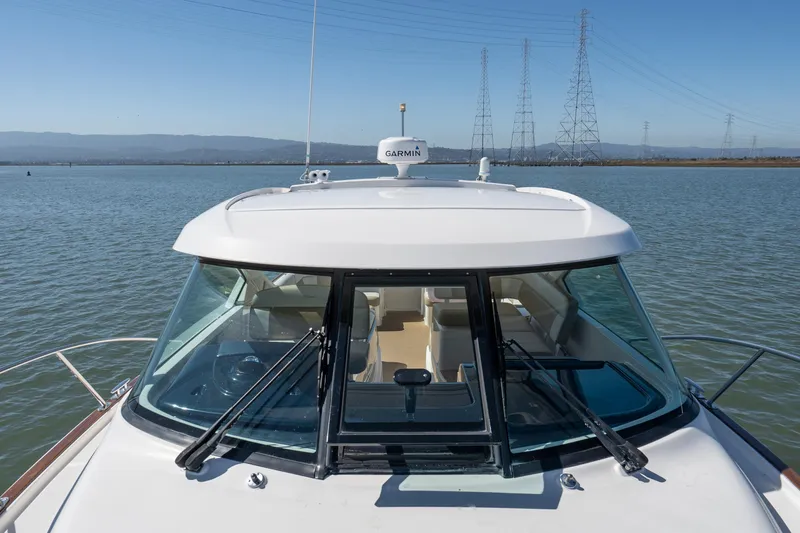 Slide: The Image of 2012 Tiara Yachts 3100 Coronet on calm water with clear sky. - 25