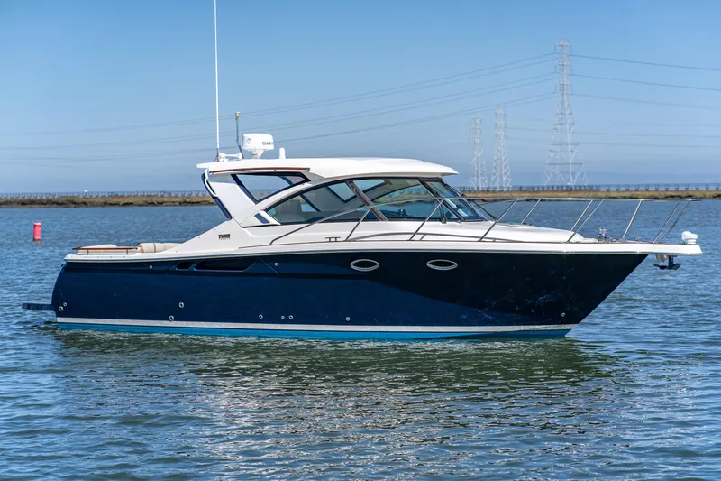 Slide: The Image of 2012 Tiara Yachts 3100 Coronet on calm water. - 3