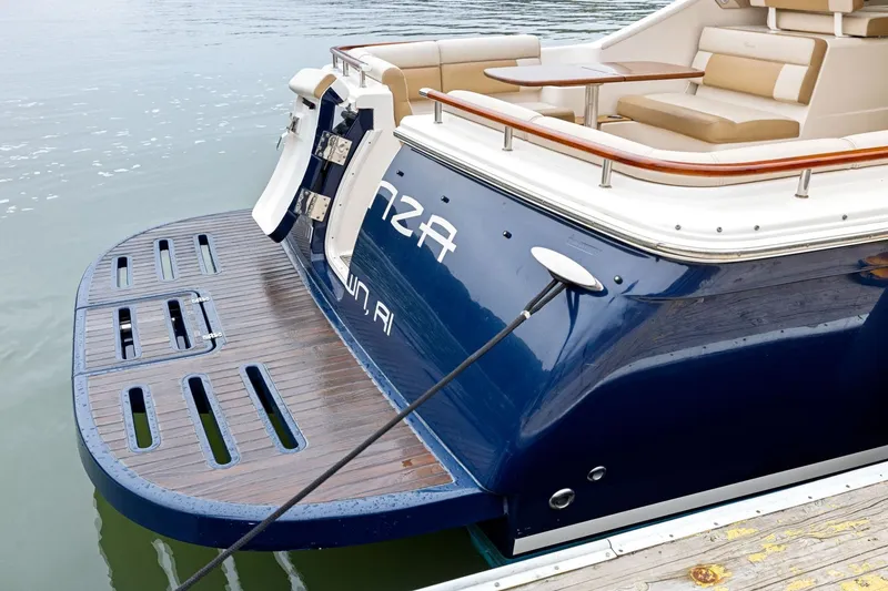 Slide: The Image of 2012 Tiara Yachts 3100 Coronet with wooden swim platform and seating area. - 37