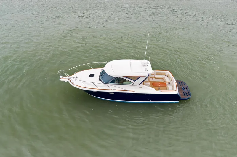 Slide: The Image of 2012 Tiara Yachts 3100 Coronet cruising on calm waters, aerial view. - 61