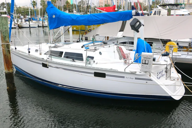 The Image of 1993 Hunter 33.5 sailboat docked in marina. - 0