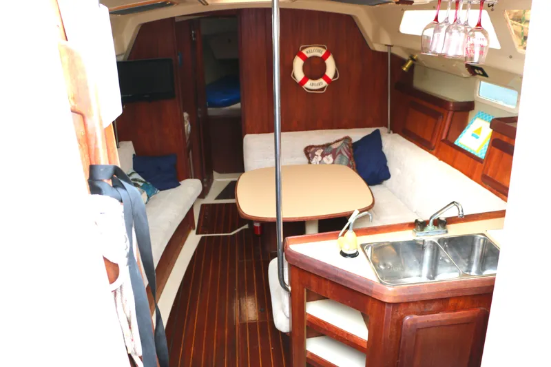 Slide: The Image of Interior of a 1993 Hunter 33.5 yacht with cozy seating area. - 21