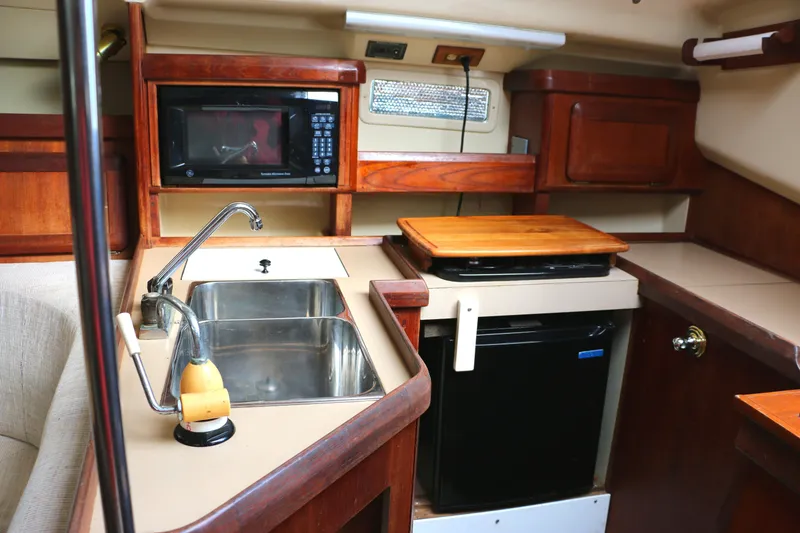 Slide: The Image of Interior of 1993 Hunter 33.5 yacht kitchen. - 25